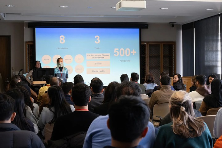 Participants working together at a health innovation hackathon