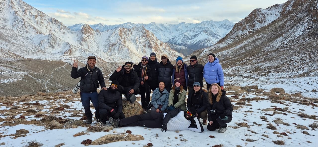 The mission team together in the snowy mountains