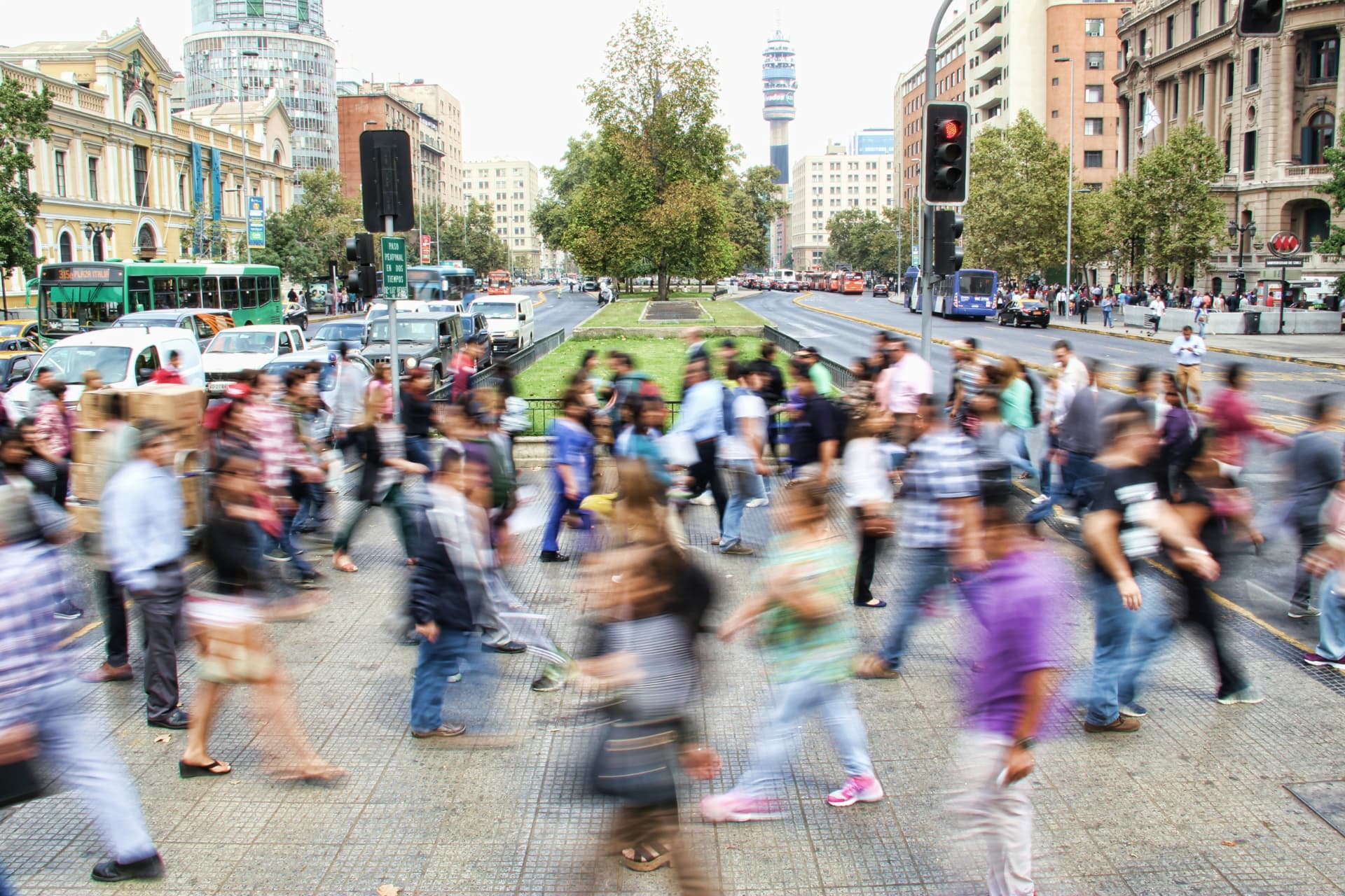 A busy city crossing with people in motion