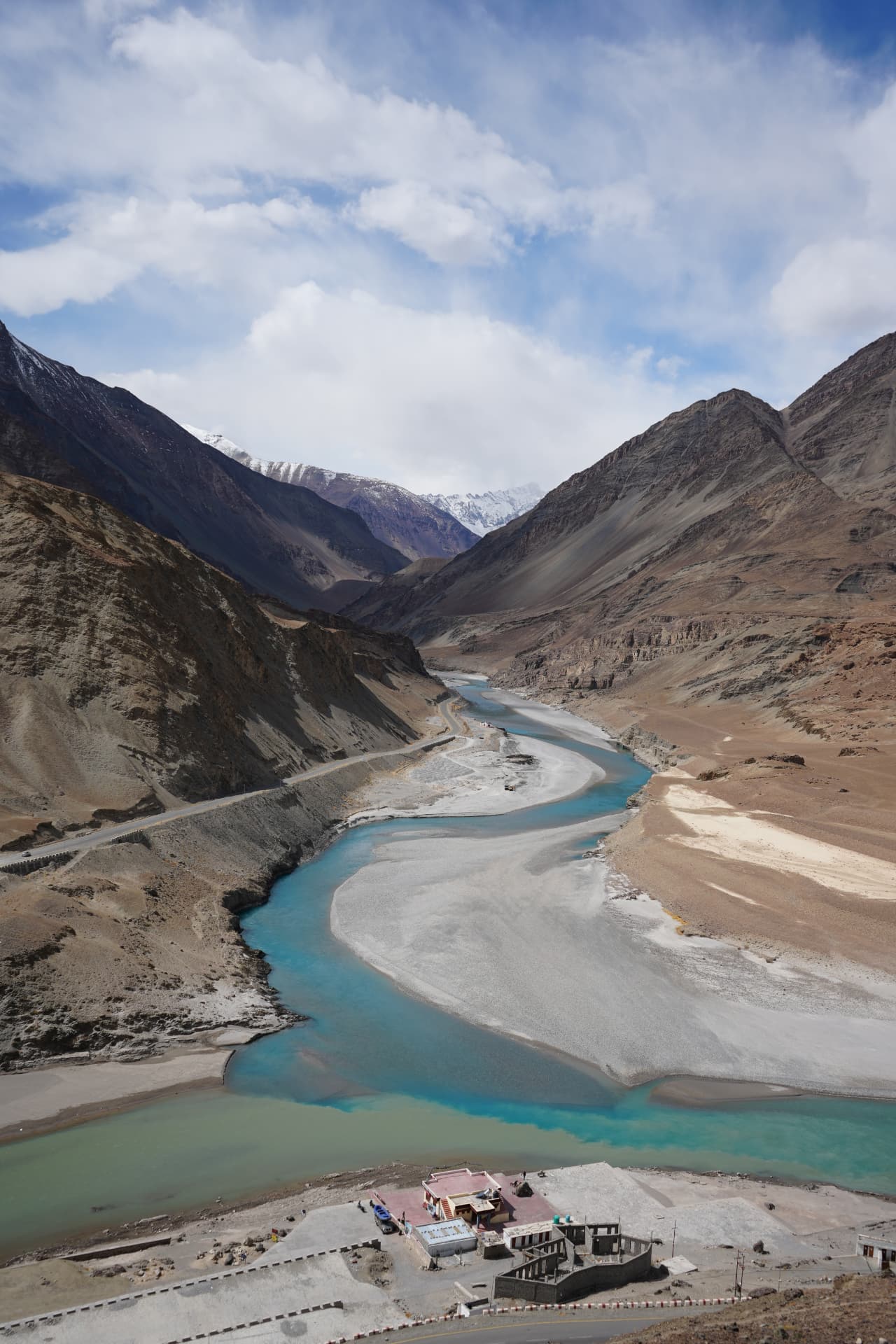 Confluence of turquoise rivers in the Ladakh mountains
